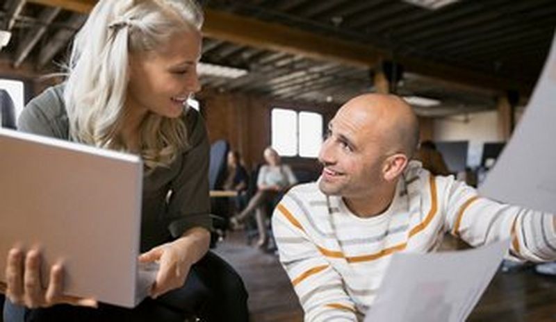 Business people discussing paperwork in office